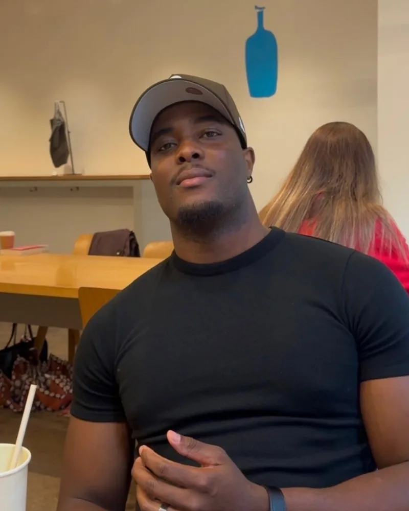 Terry Jayaguru, founder of Platinum Shine, in a black T-shirt and cap